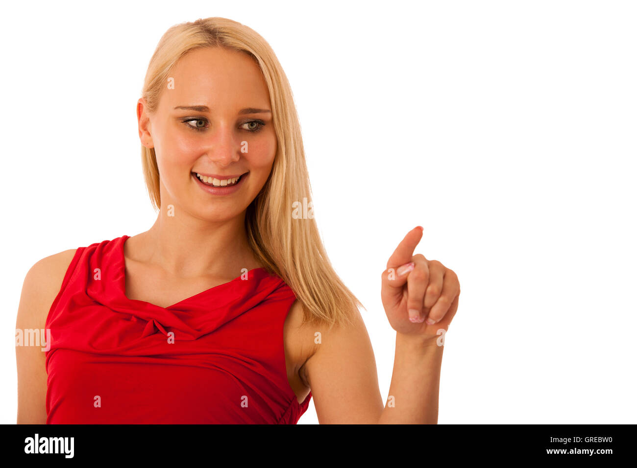 business Woman in red shirt  pointing into copy space isolated over white background for commercial Stock Photo