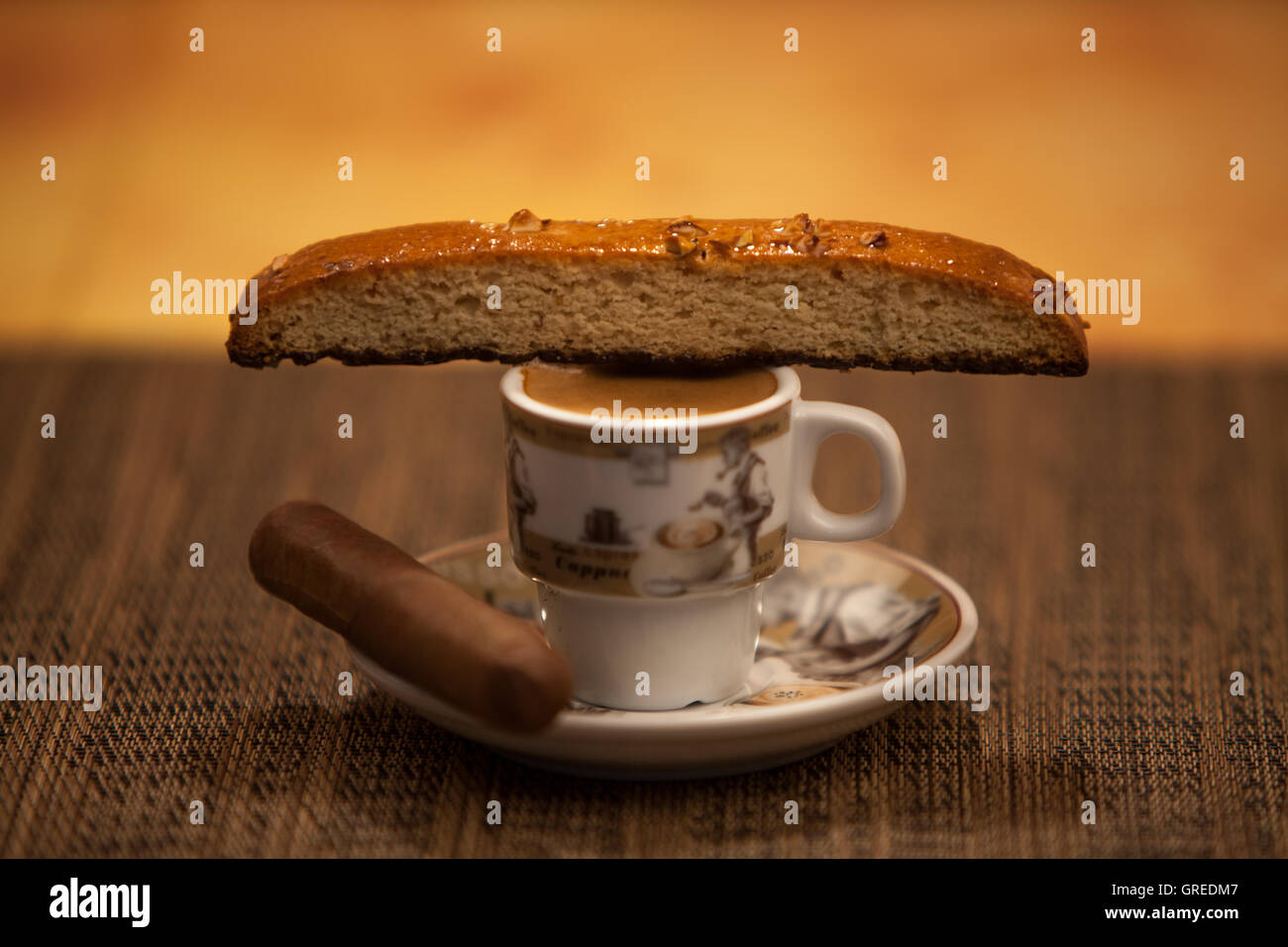 Cuban Coffee accompanied with a biscotti and a morning cigar Stock Photo