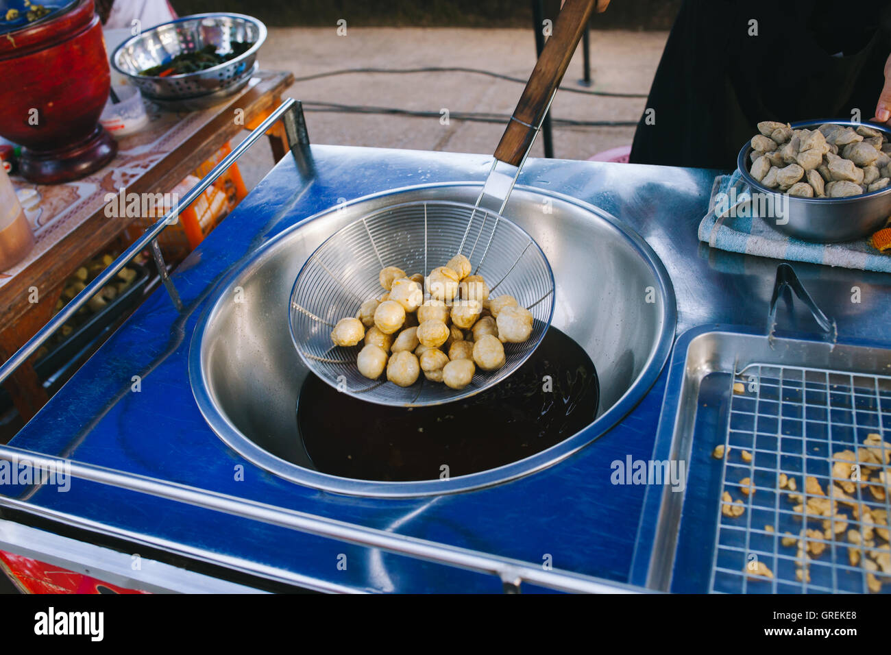Cooking, Deep frying fishball in the pan in hot oil. street food in