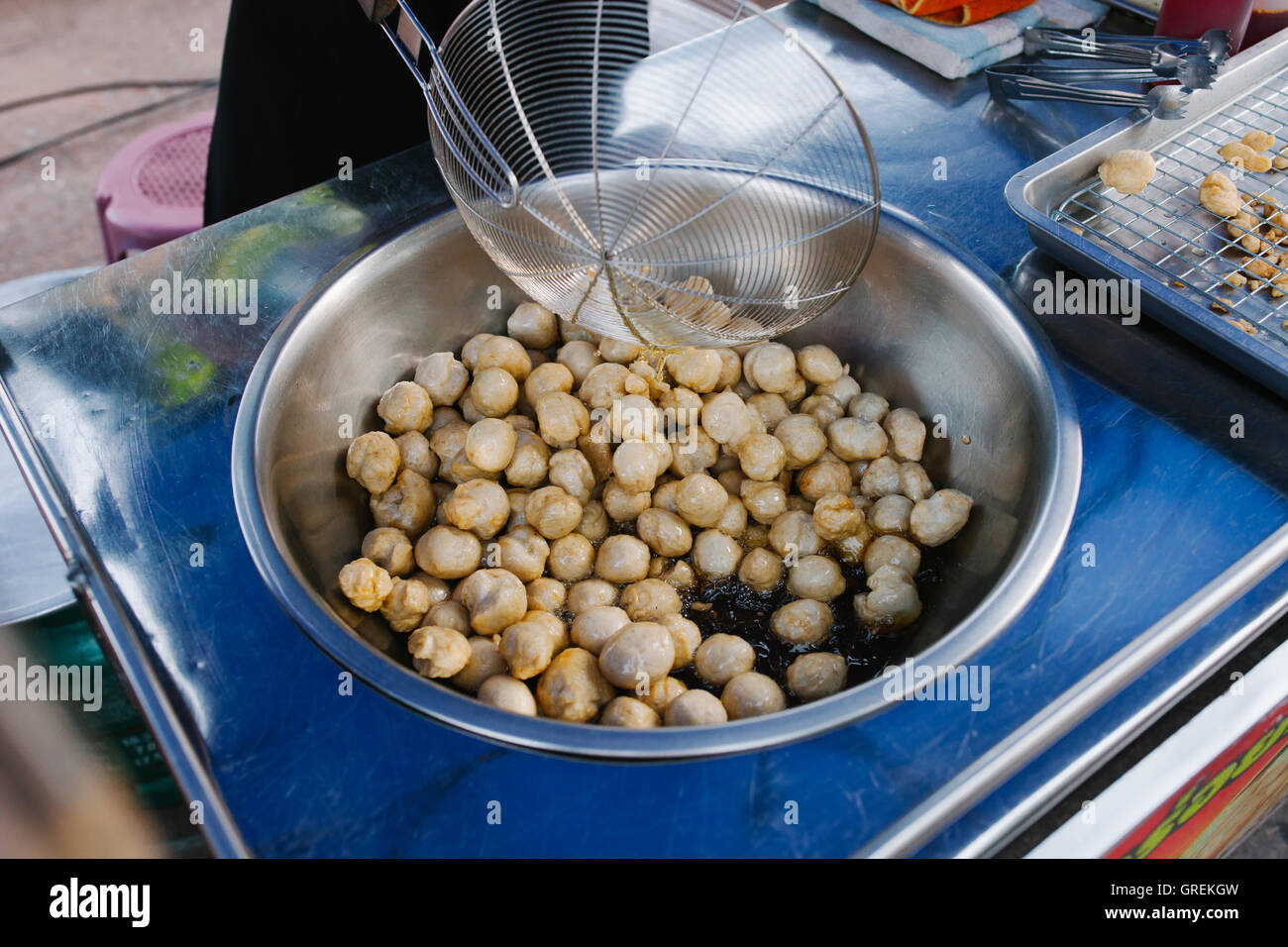 Cooking, Deep frying fishball in the pan in hot oil. street food in