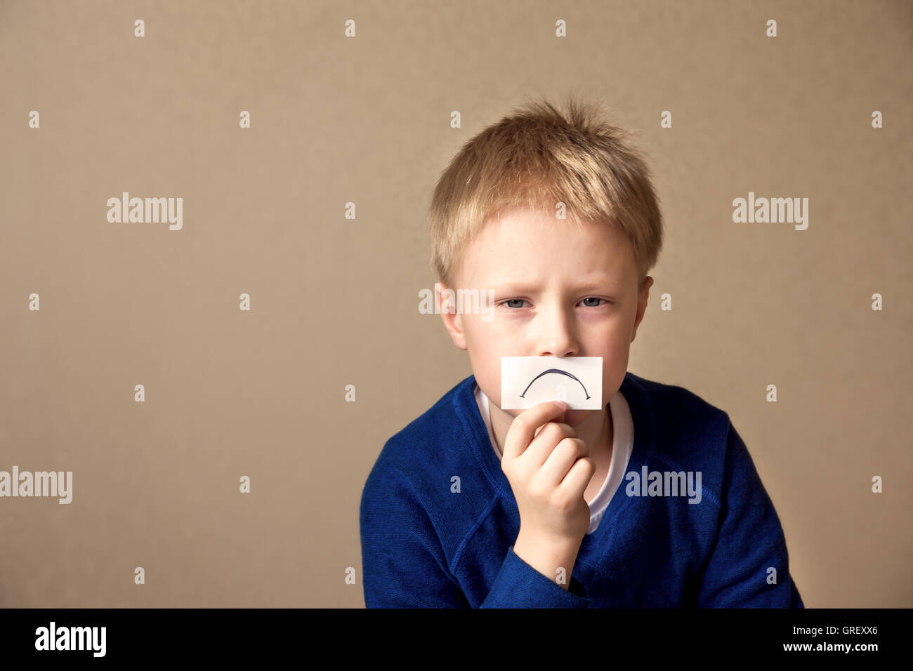 Upset sad young boy (teen) goes to stress, negative mood. Portrait with copy space Stock Photo
