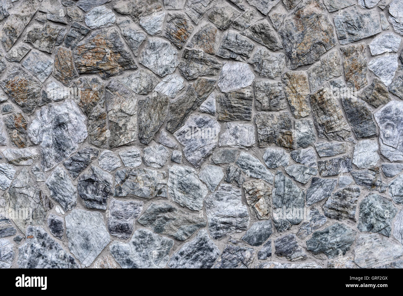 Abstract background - masonry from gray-blue stones close-up Stock Photo