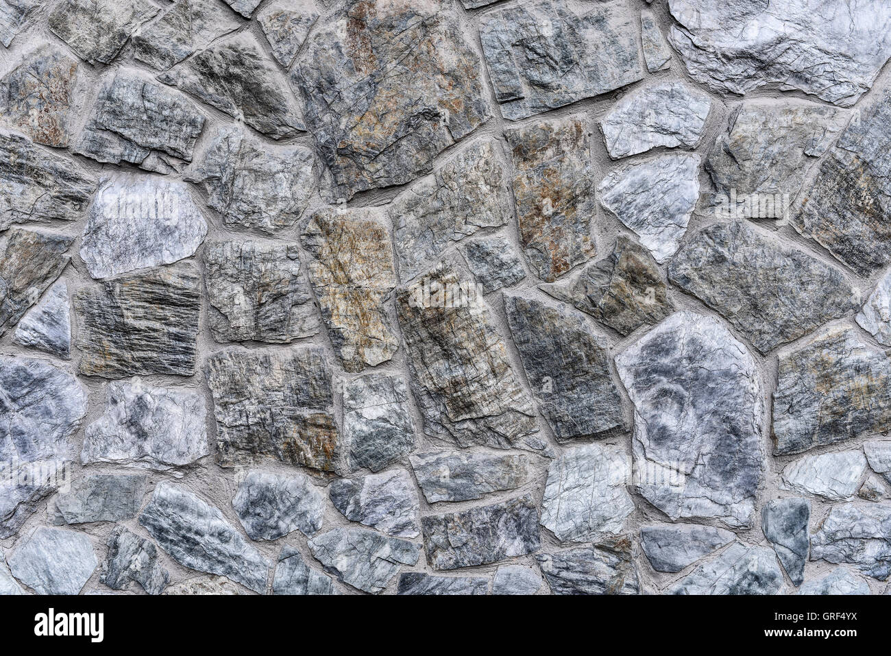 Abstract background - masonry from gray-blue stones close-up Stock Photo