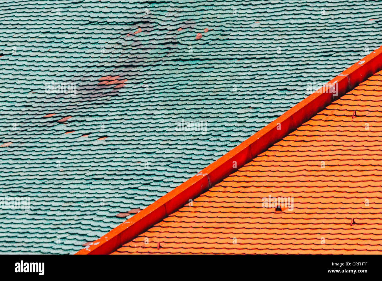 Green and red roof tiles Stock Photo