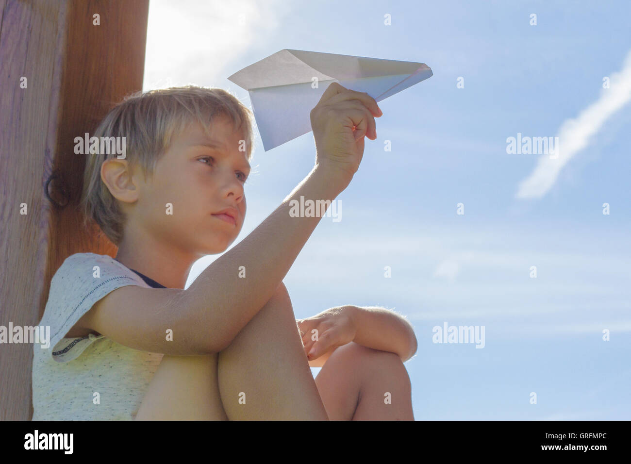 Boy flying paper airplane hi-res stock photography and images - Alamy