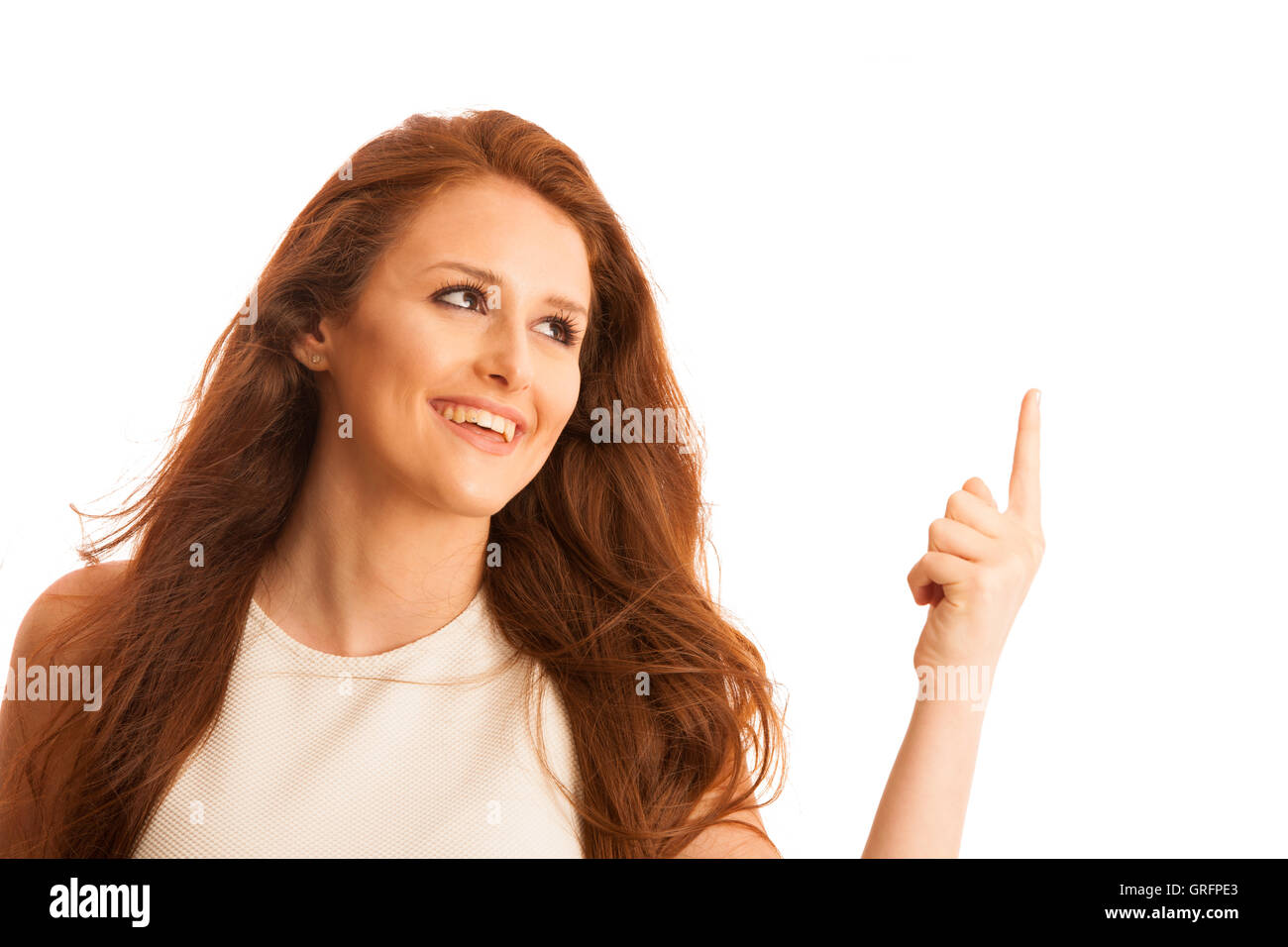 Business woman pointing to copy space while presenting a product in commercial - having new idea isolated over white Stock Photo