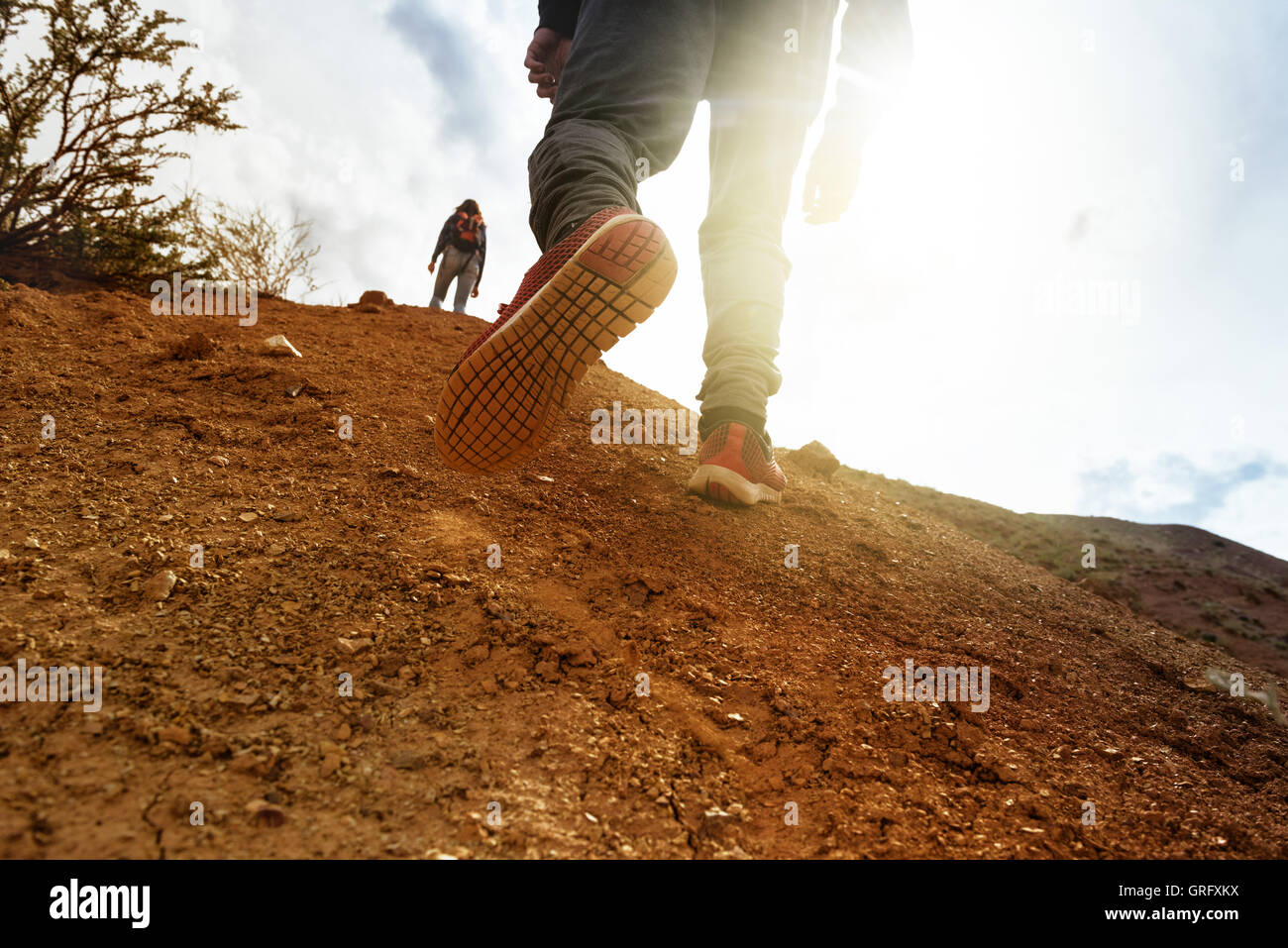 Closeup concept man goes uphill Stock Photo