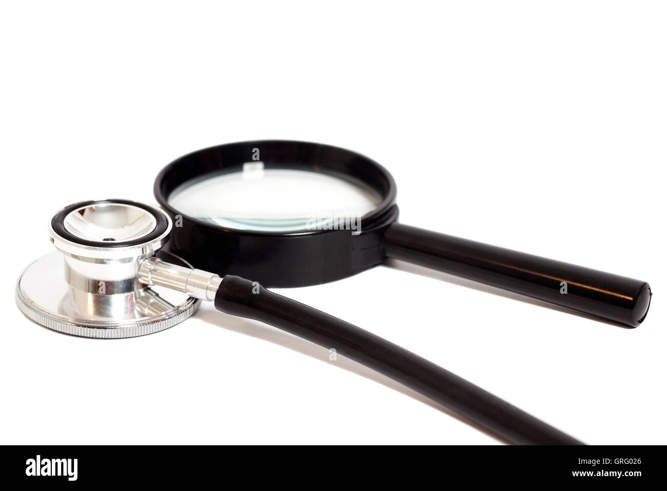 Magnifying Glass With Stethoscope isolated on white.Health concept