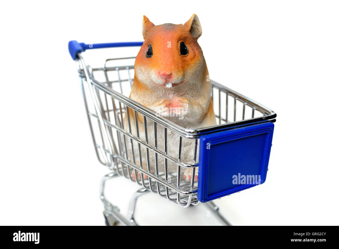 Hamster figure sitting in a shopping cart, hoarding Stock Photo