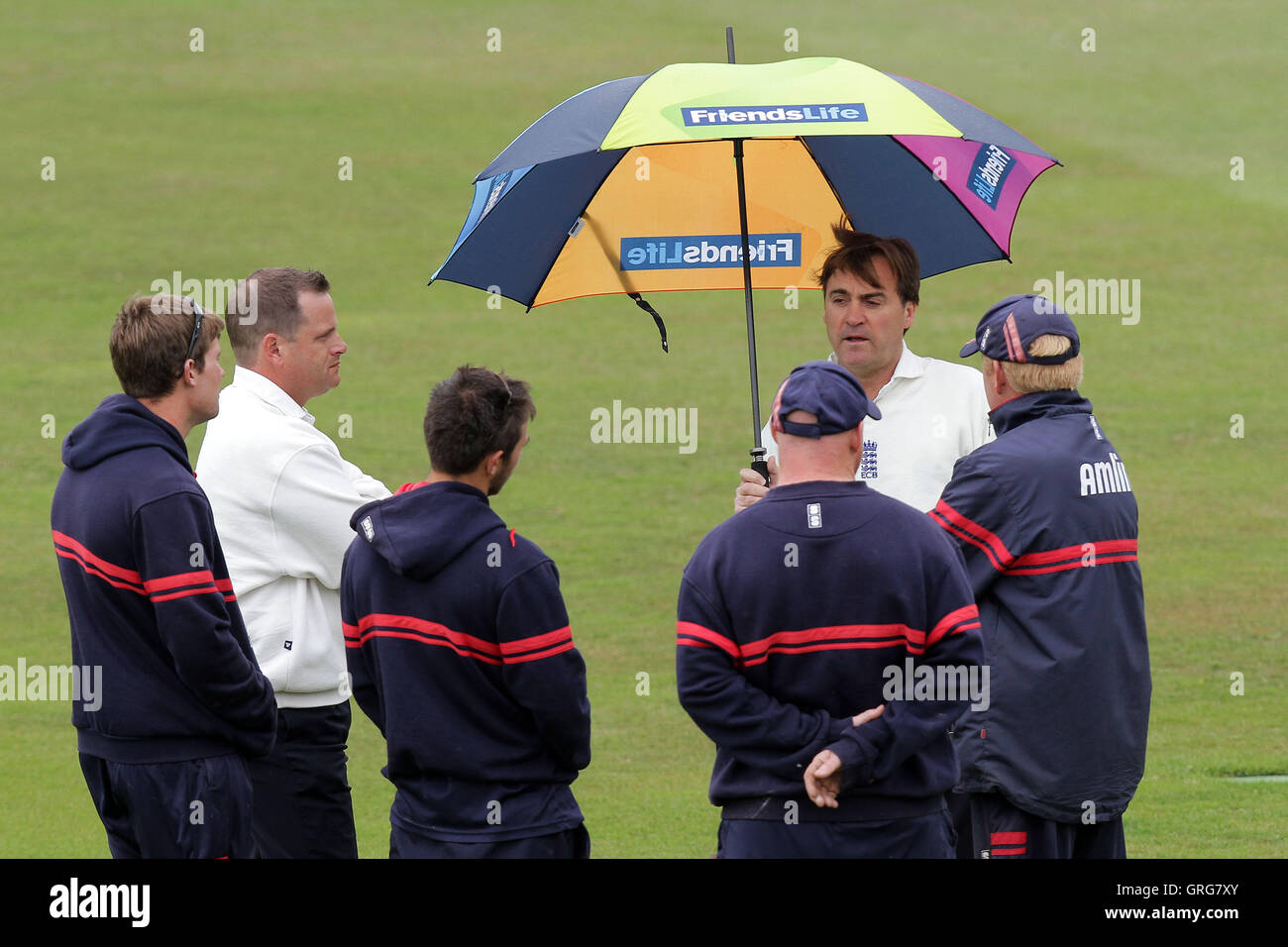 Umpires and ground staff discuss the prospects of play as rain falls - Essex vs Sri Lanka - Tourist Match Cricket at the Ford County Ground, Chelmsford - 12/06/11 Stock Photo