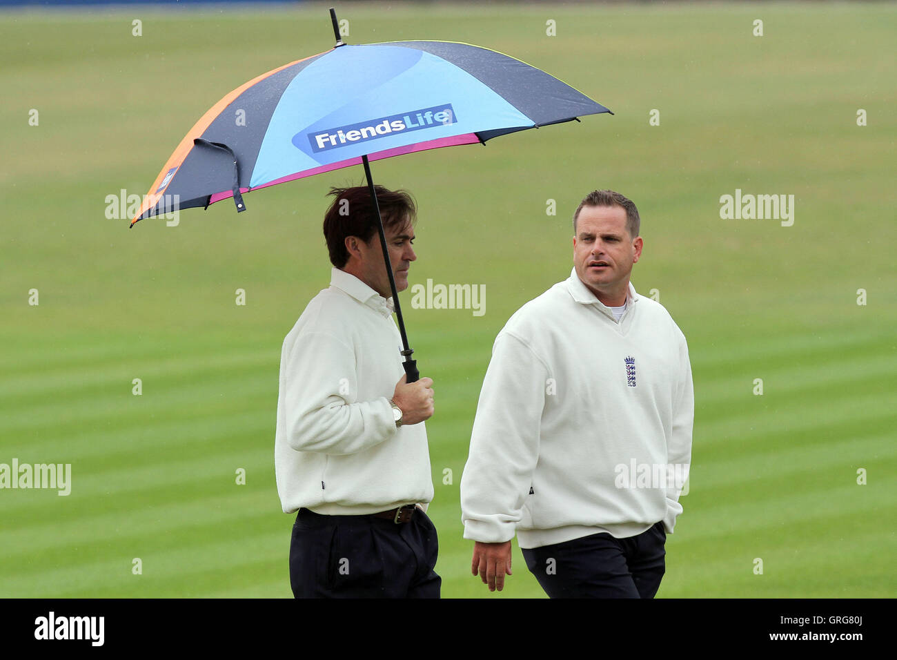 Umpires Steve O'Shaughnessy (L) and Paul Baldwin assess the prospects of play as rain falls - Essex vs Sri Lanka - Tourist Match Cricket at the Ford County Ground, Chelmsford - 12/06/11 Stock Photo