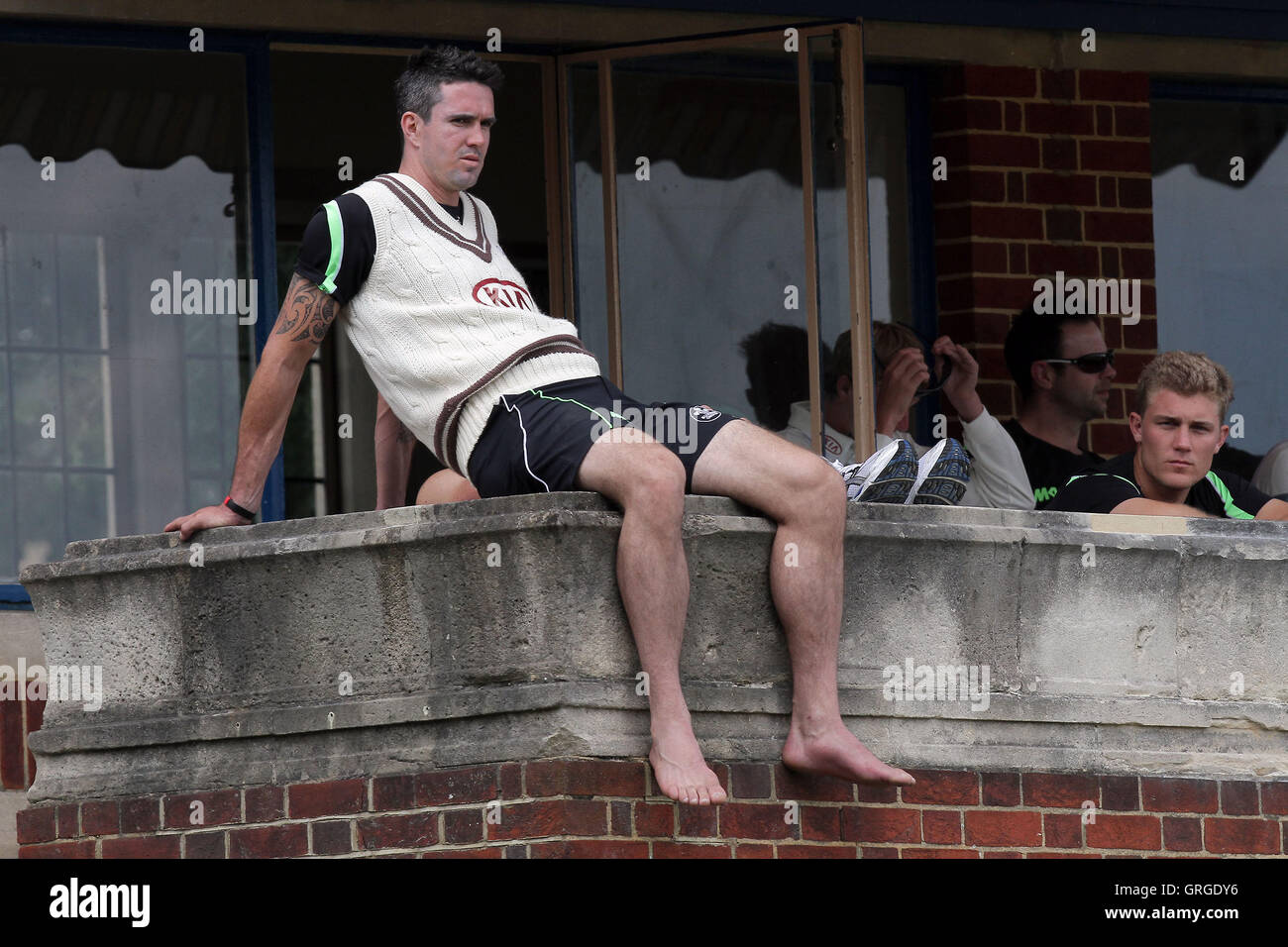 Kevin Pietersen of Surrey sits on the home dressing room balcony at Whitgift School - Surrey CCC vs Essex CCC - LV County Championship Division Two Cricket at Whitgift School - 20/05/11 Stock Photo