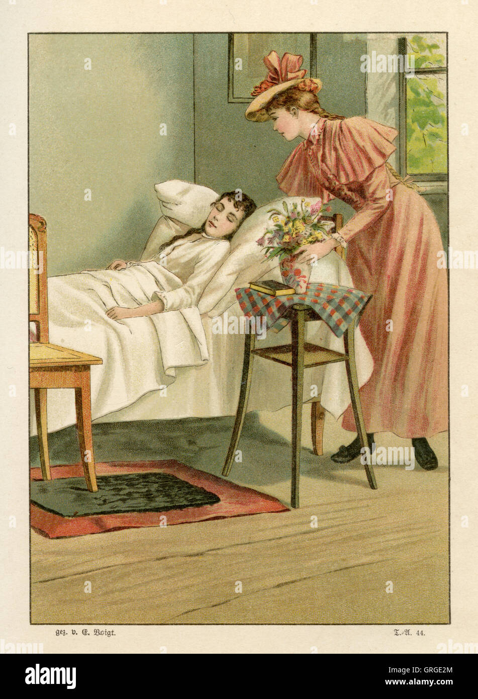 visiting a sick young woman at her bed Stock Photo