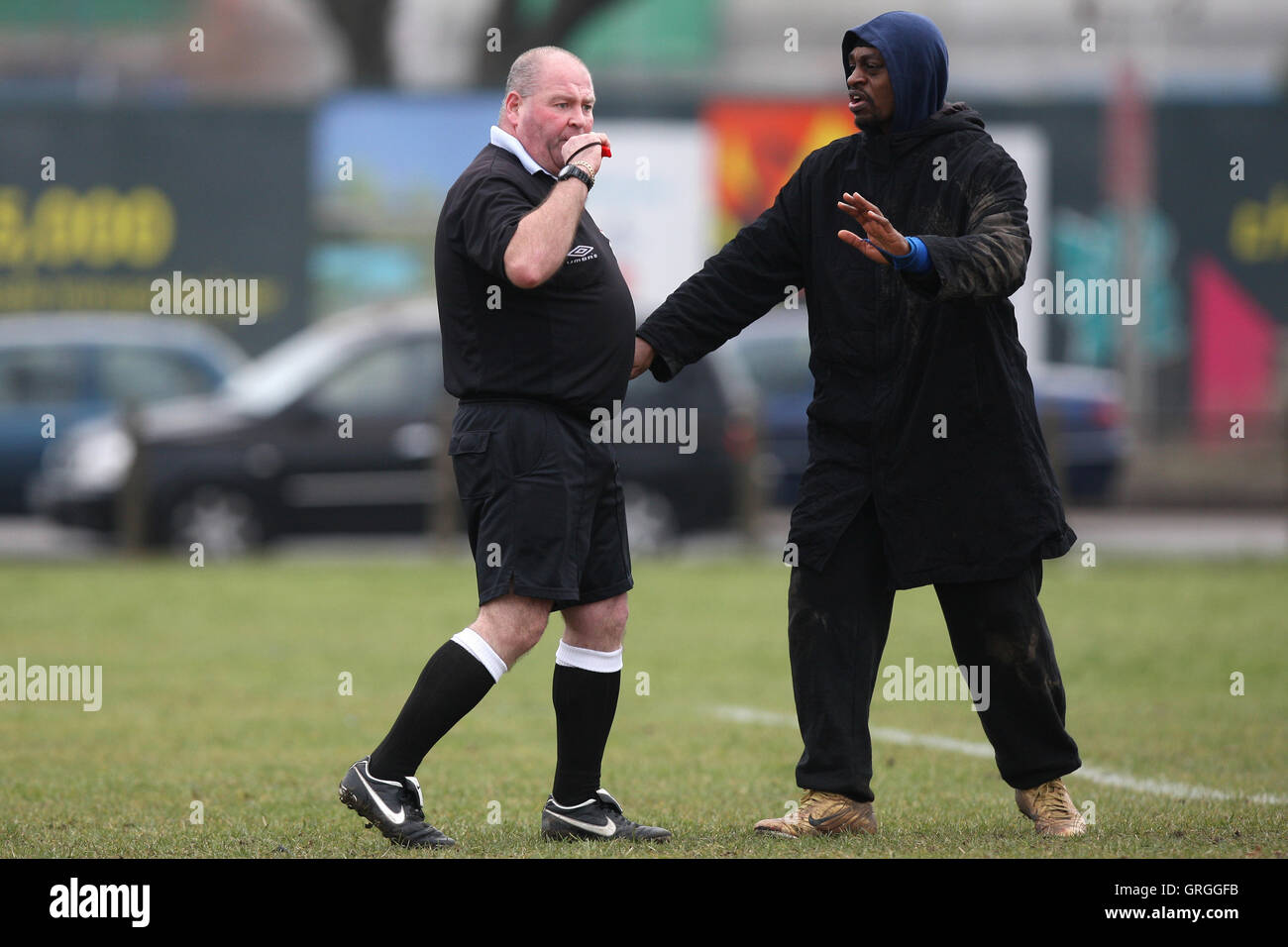 The match referee blows his whistle as trouble flares during a Hackney