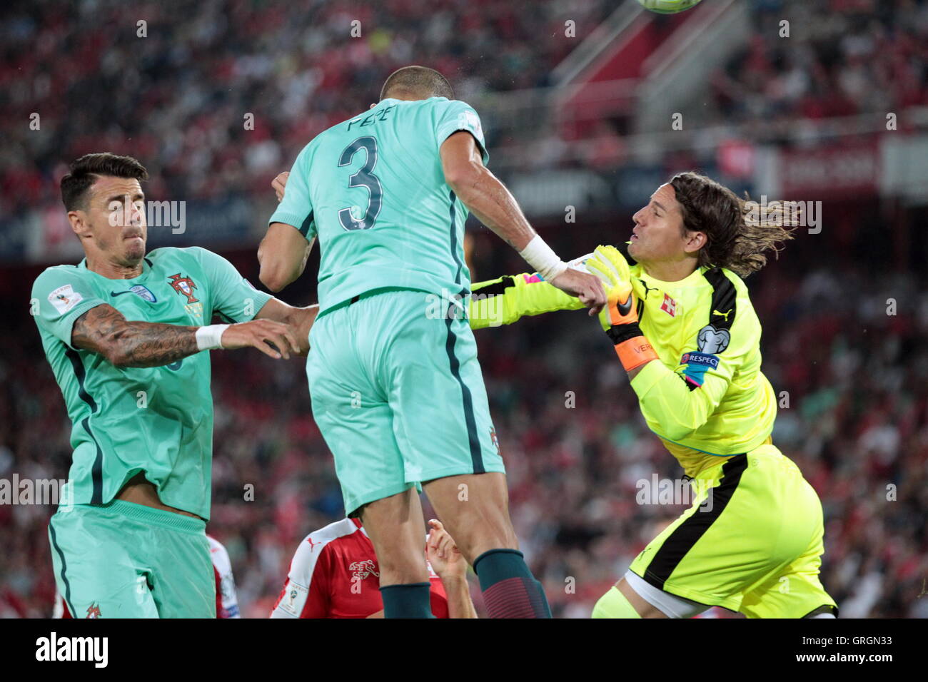 06.09.2016. St Jakob-Park, Basel, Switzerland. Goalie Yann Sommer (su) punches clear from Pepe (por) during the qualifying match of the World Cup Group B Switzerland against Portugal at St Jakob Park in Basel, Switzerland Stock Photo