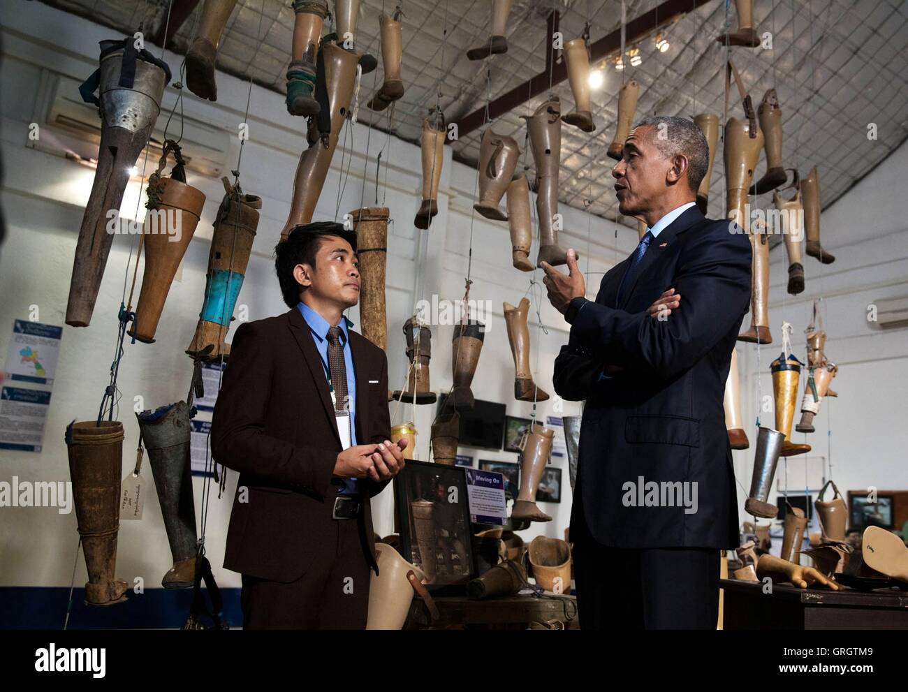 Vientiane, Laos. 6th September, 2016. U.S President Barack Obama meets with unexploded ordnance survivor Thoummy Silamphan from the Quality of Life Association, as he tours the Cooperative Orthotic Prosthetic Enterprise Visitor Centre September 7, 2016 in Vientiane, Laos. Obama is in Laos for the ASEAN Summit. Credit:  Planetpix/Alamy Live News Stock Photo