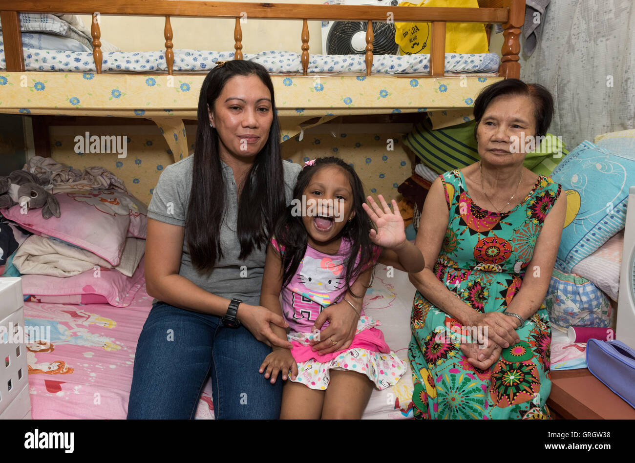 Hong Kong, Hong Kong S.A.R, China. 3rd July, 2016. Refugee Vanessa Mae Rodel (L) and daughter Keana (M) with her mother (R) who hid Snowden.After leaving the Mira Hotel, Edward Snowden went into hiding with refugees in the city.Their story is touched on in the new Oliver Stone film Snowden that premieres in September 2016. © Jayne Russell/ZUMA Wire/Alamy Live News Stock Photo