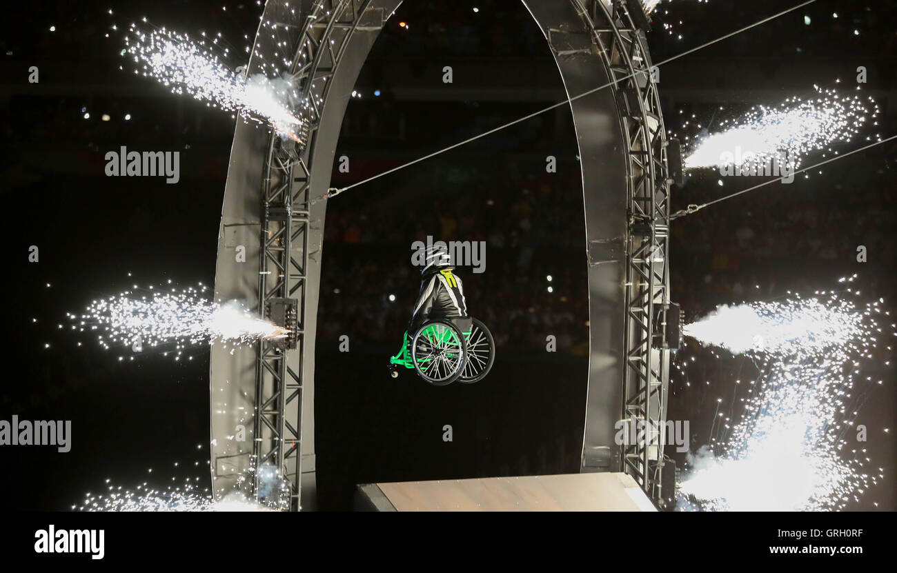 Wheelchair user Aron Wheelz jumps through fireworks at Maracana Stadium