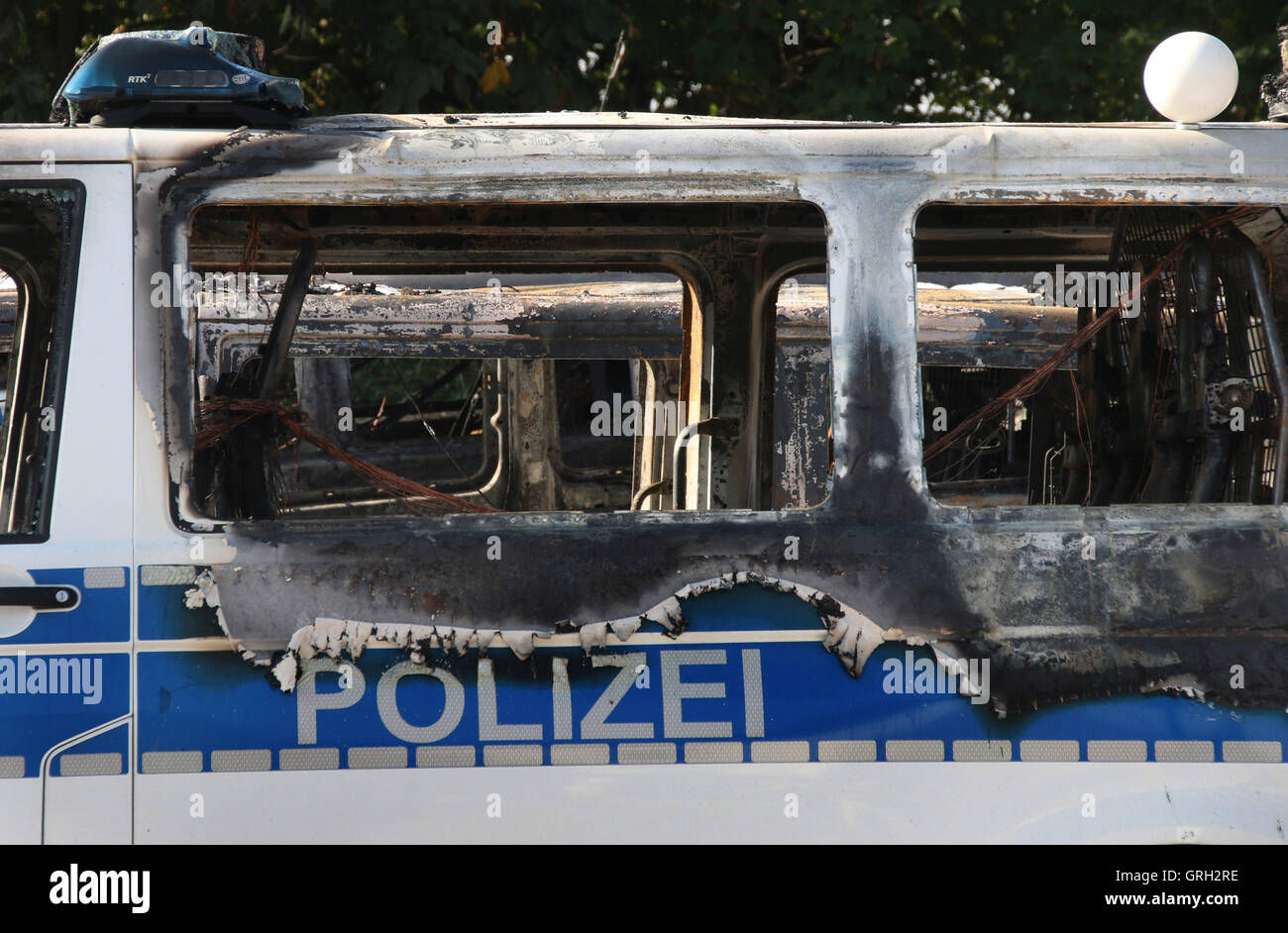 Magdeburg, Germany. 8th Sep, 2016. View of one of several burned down cars, including cars of the federal police and Deutsche Bahn, at the central station in Magdeburg, Germany, 8 September 2016. 18 cars were burning during Wednesday night on the grounds of the federal police. The police investigates a heavy arson attack. The damage sums up to 750,000 Euro. PHOTO: FOERSTER/dpa/Alamy Live News Stock Photo