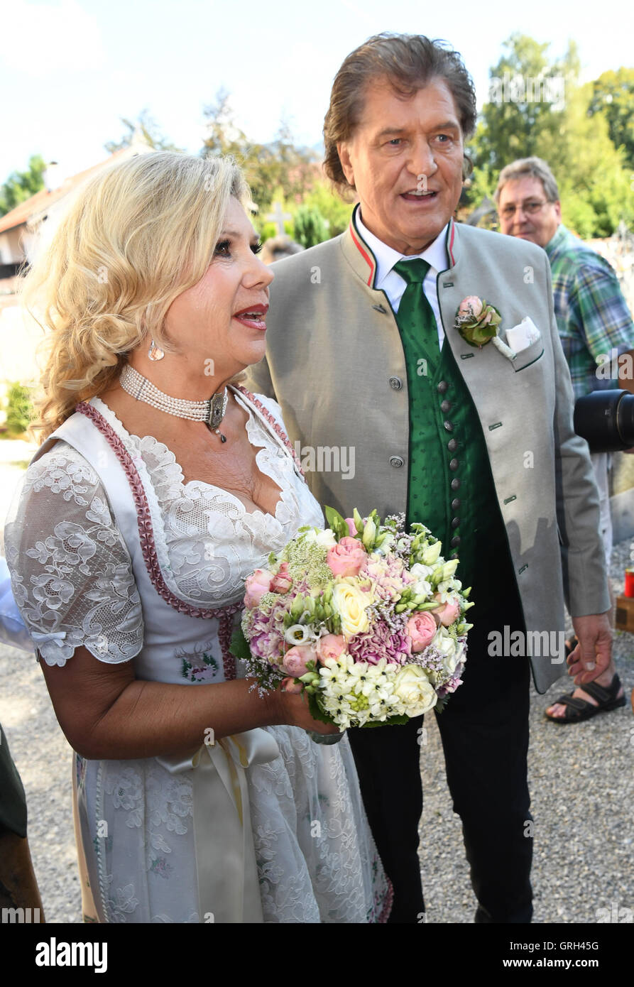 Rottach-Egern, Germany. 08th Sep, 2016. The musician couple Marianne and Michael arrives to their Catholic wedding in the St. Laurentius church on Tegernsee lake in Rottach-Egern, Germany, 08 September 2016. They were married in a civil ceremony three decades ago - now comes the church wedding. Photo: PETER KNEFFEL/dpa/Alamy Live News Stock Photo