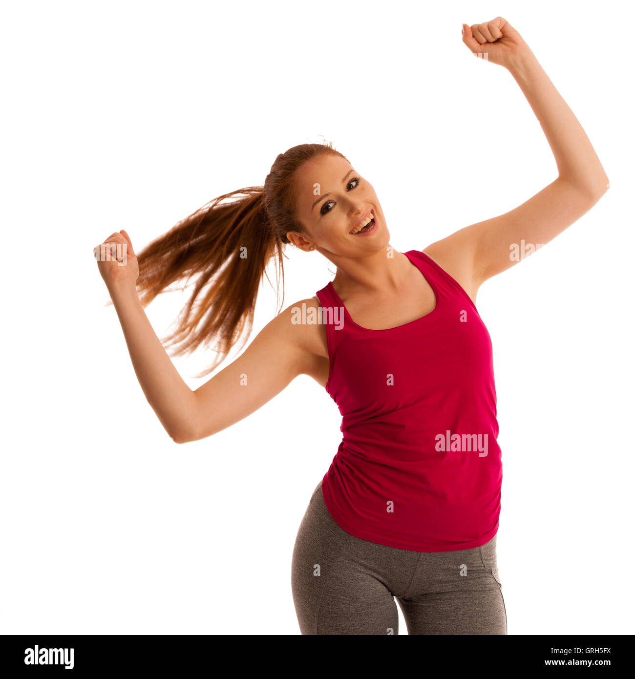 success - woman gesturing victory with her hands raised in the air ...