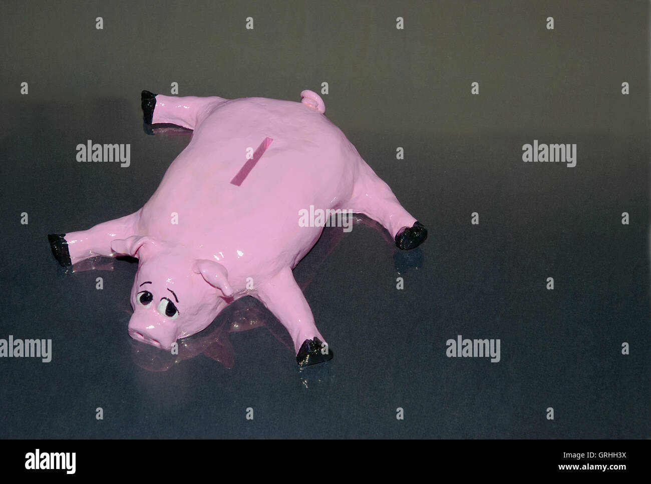 Depressed piggy bank Stock Photo