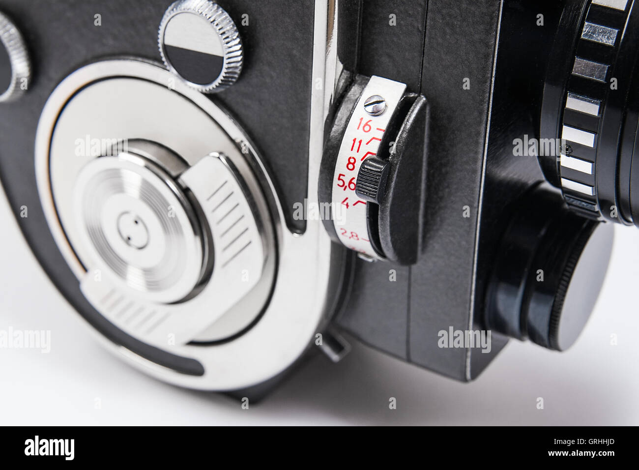 Old movie camera with lens isolated on a white background. Close up