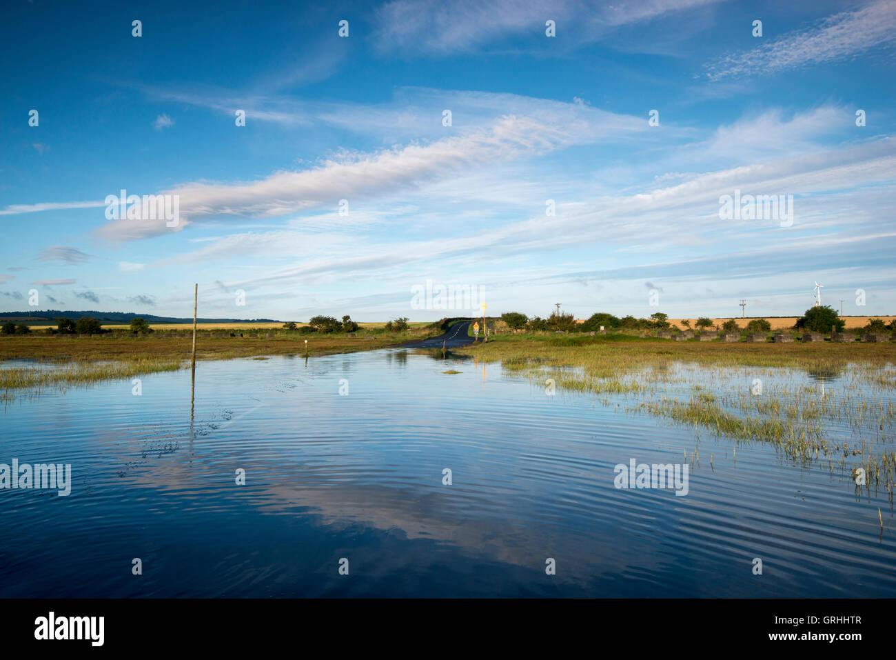Reflections in the causeway at Holy Island, Northumberland England UK Stock Photo
