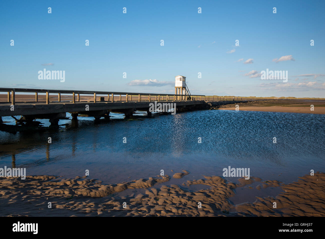 The causeway at Low Tide on Holy Island, Northumberland England UK Stock Photo