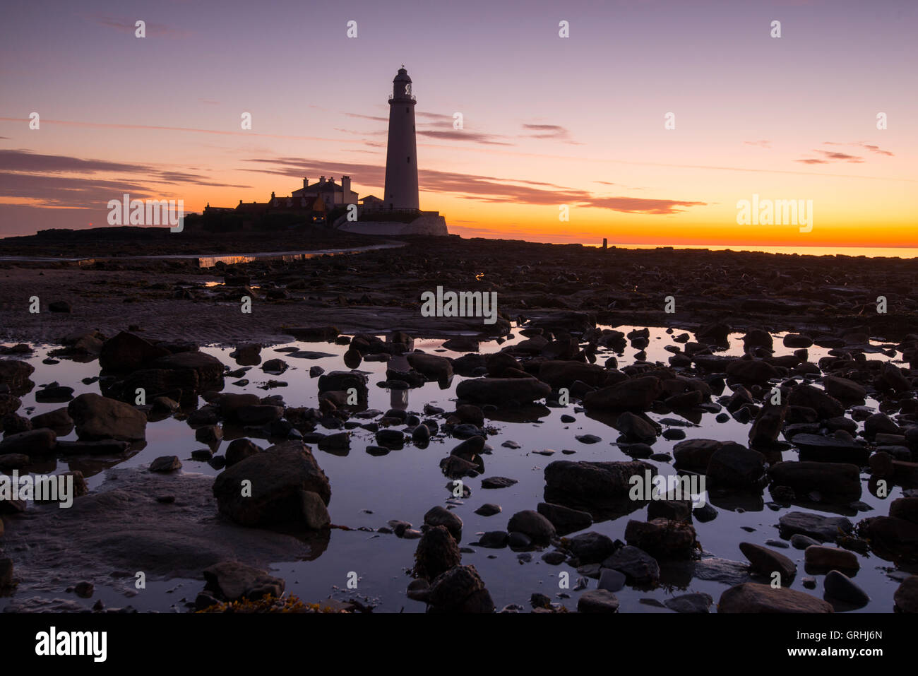 Sunrise at St Mary's Lighthouse, near Whitley Bay in Tyne and Wear England UK Stock Photo