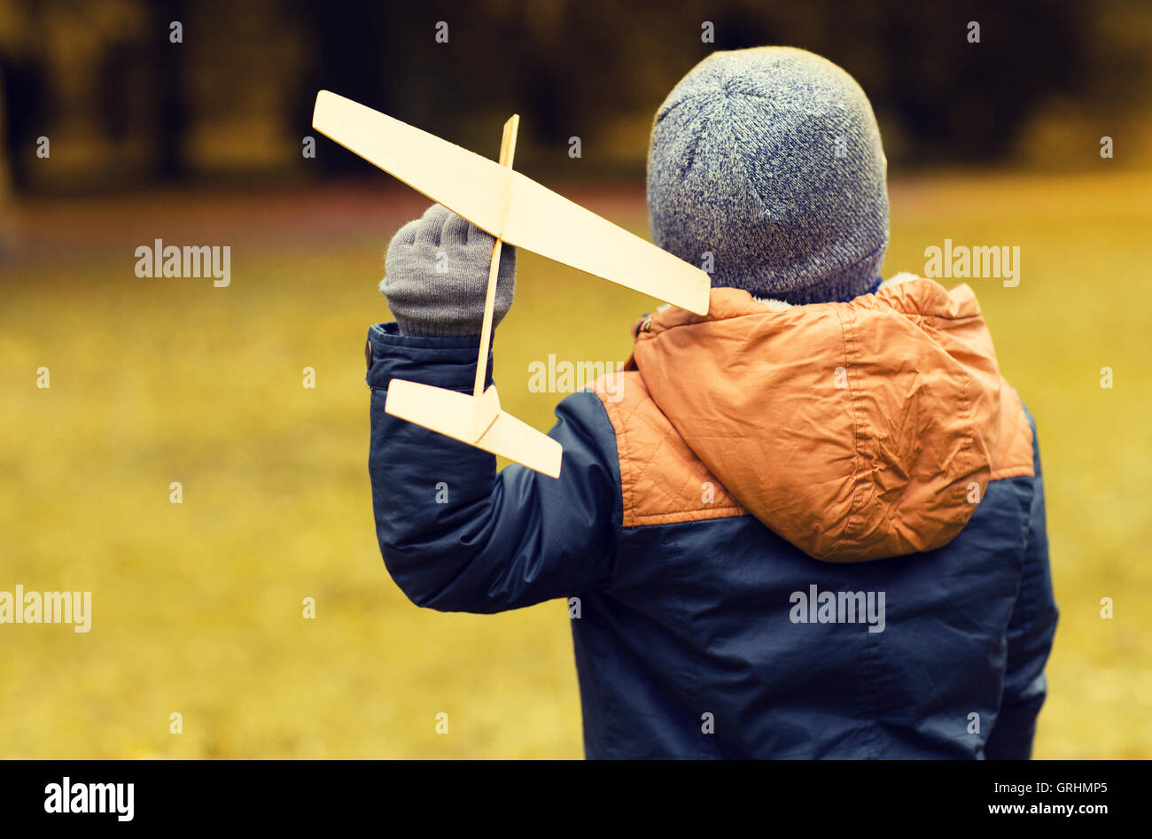 happy little boy playing with toy plane outdoors Stock Photo - Alamy
