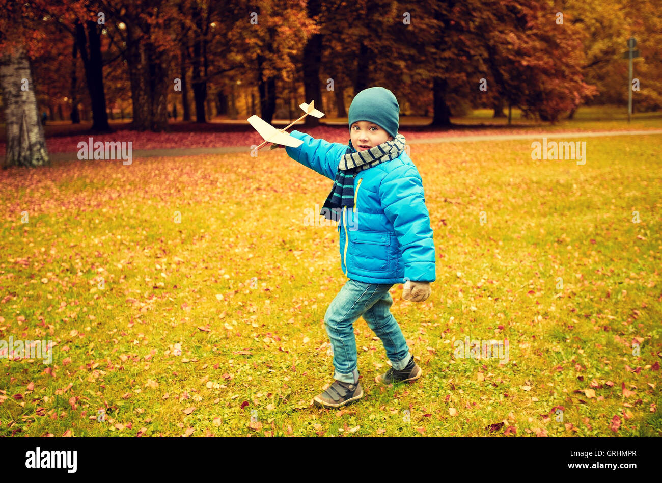 happy little boy playing with toy plane outdoors Stock Photo - Alamy