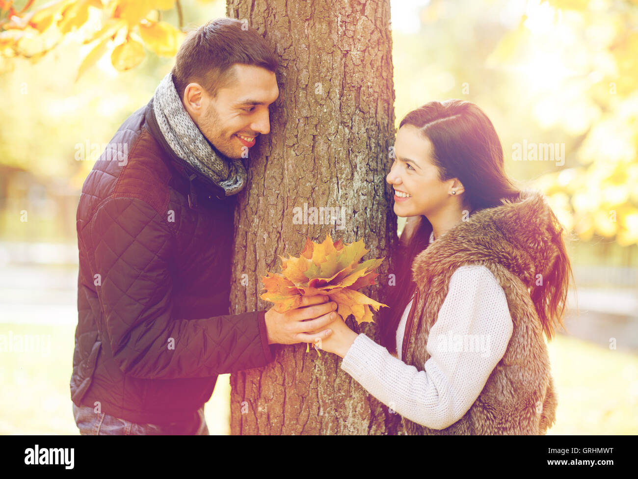 romantic couple playing in the autumn park Stock Photo - Alamy