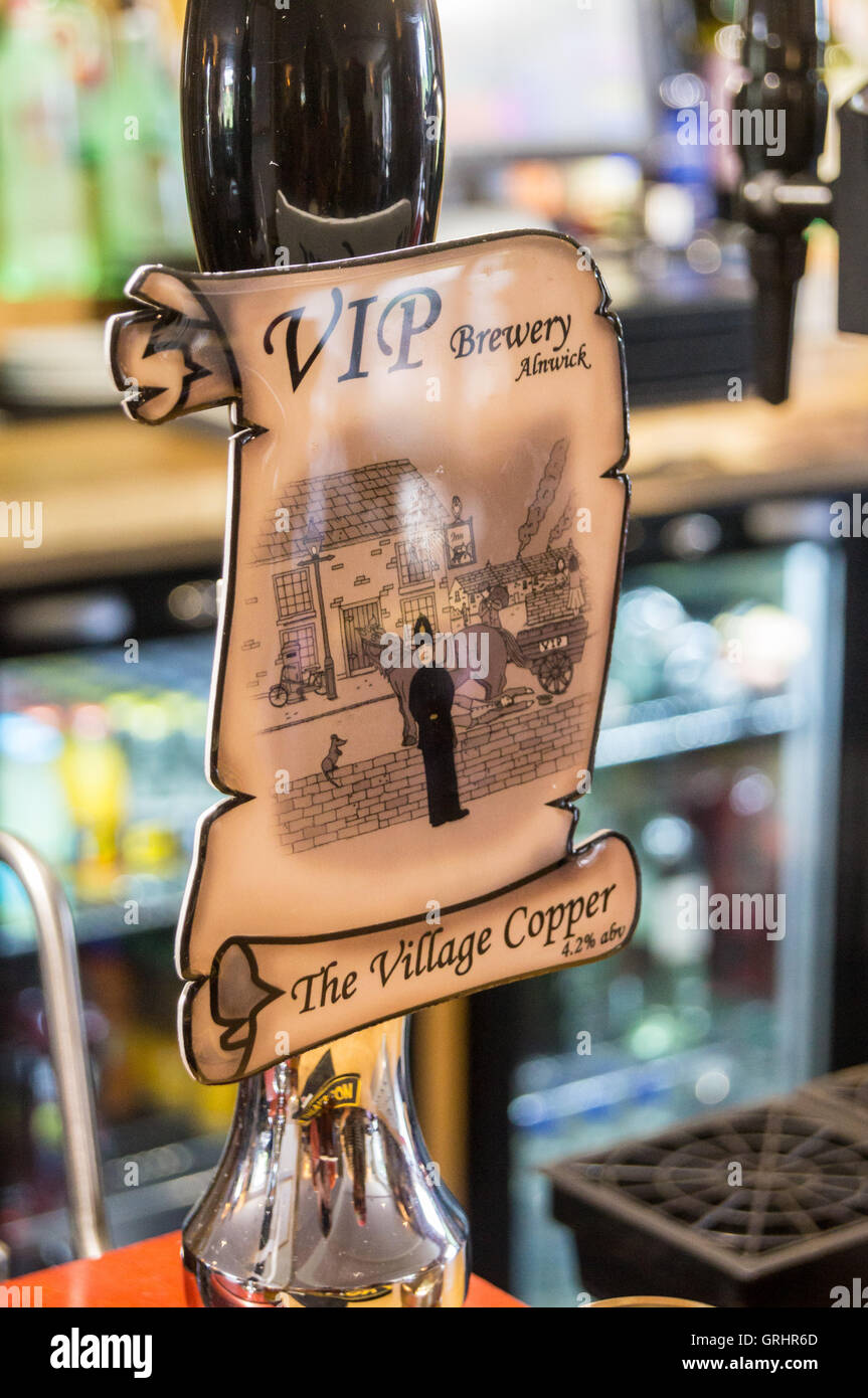 Pump clip of Village Copper beer by VIP Brewery of Alnwick,  Twice Brewed Inn, Once Brewed, Cumbria, England Stock Photo