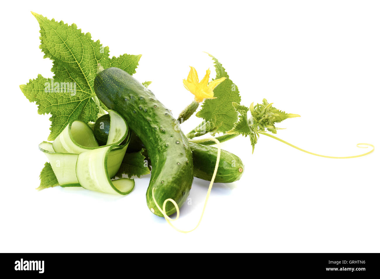 Cucumbers with leaves on white Stock Photo Alamy