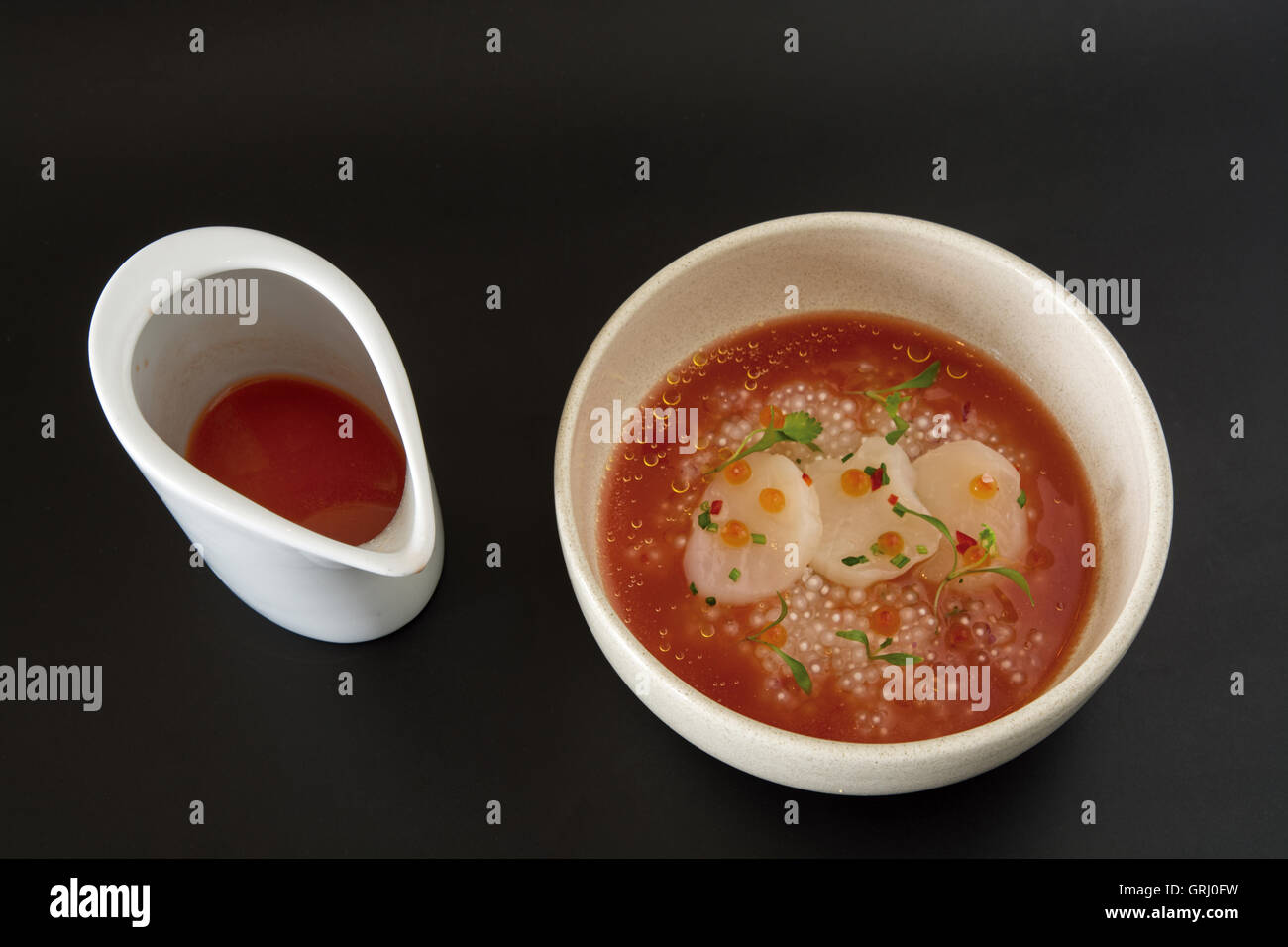 shellfish clams with molecular oysters and broth Stock Photo Alamy