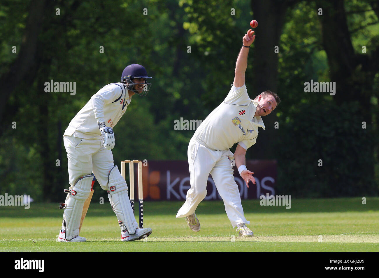 Michael Hindley in bowling action for Shenfield during Wanstead and