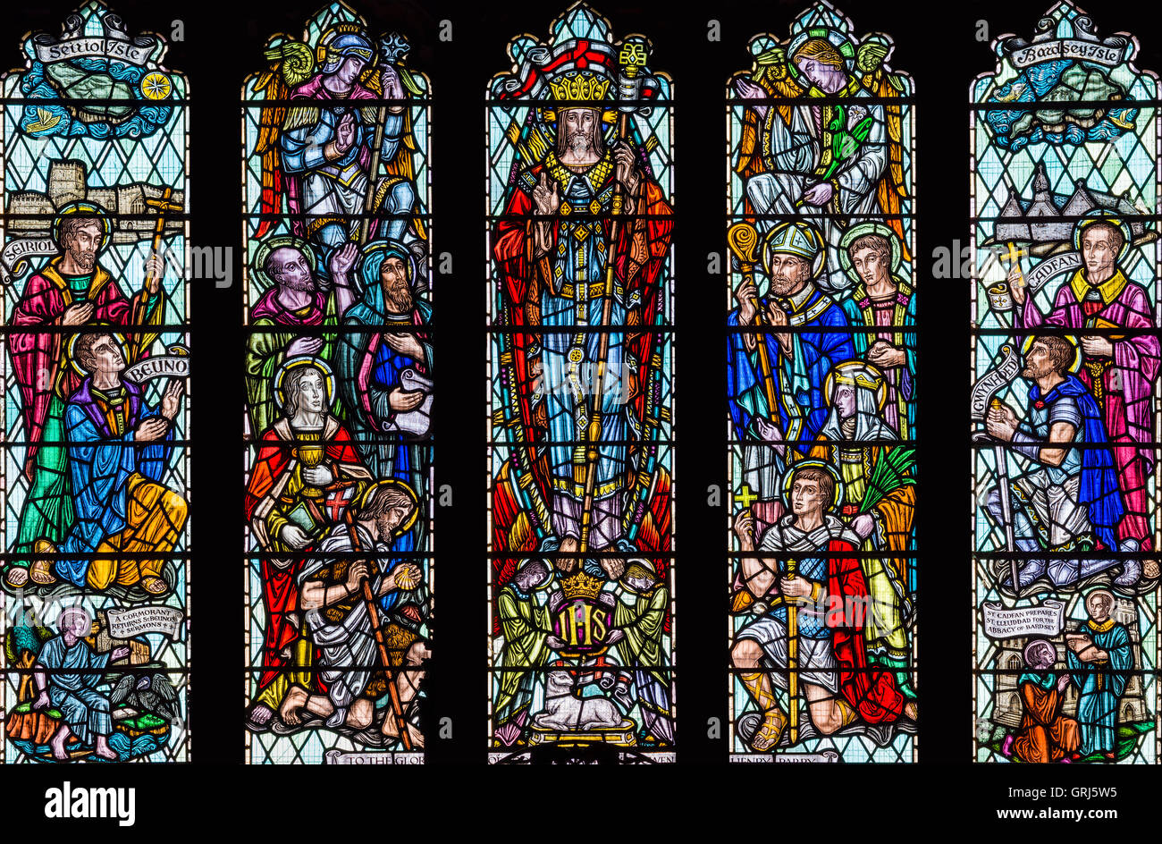 Stained glass window depicting 'Christ in Glory with Saints and Angels', Church of St. David, Nefyn, Gwynedd, Wales UK Stock Photo