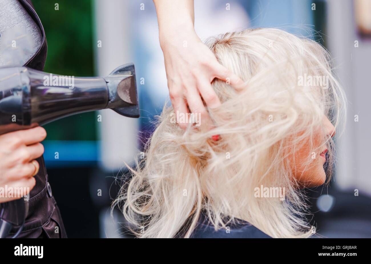 Hair style blonde blow dry hi-res stock photography and images - Alamy