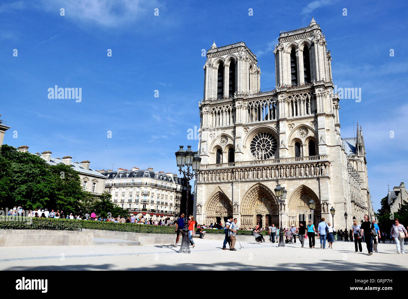 PARIS, FRANCE - MAY 7: Undefined people walking near cathedral of Notre Dame, Paris on May 7, 2011. Stock Photo