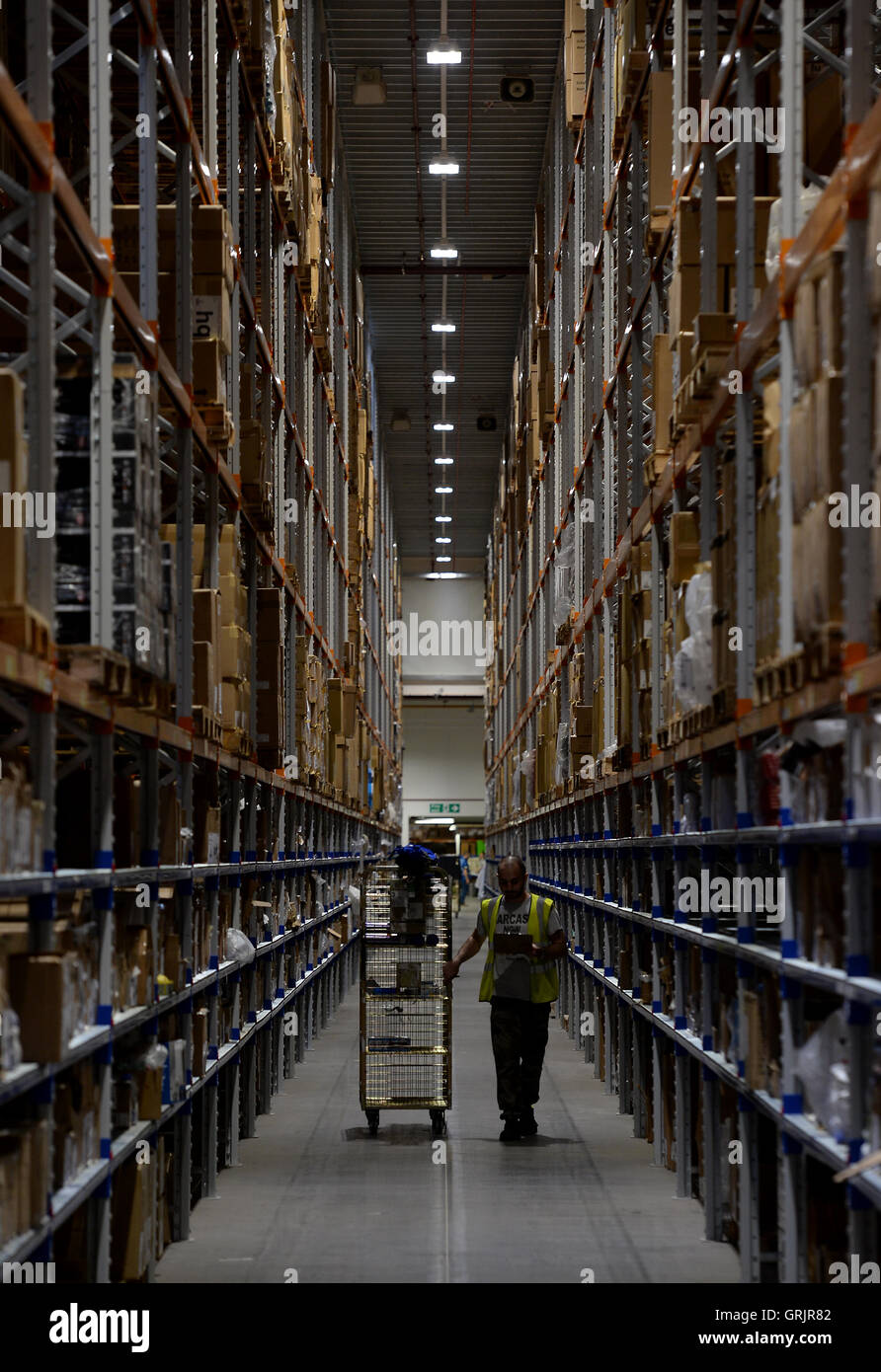 A worker in the Sports Direct warehouse in Shirebrook, Nottinghamshire, as  the company held an open day coinciding with its annual general meeting  Stock Photo - Alamy