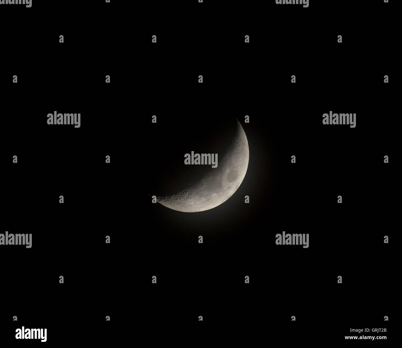 Misty Crescent moon. Stock Photo