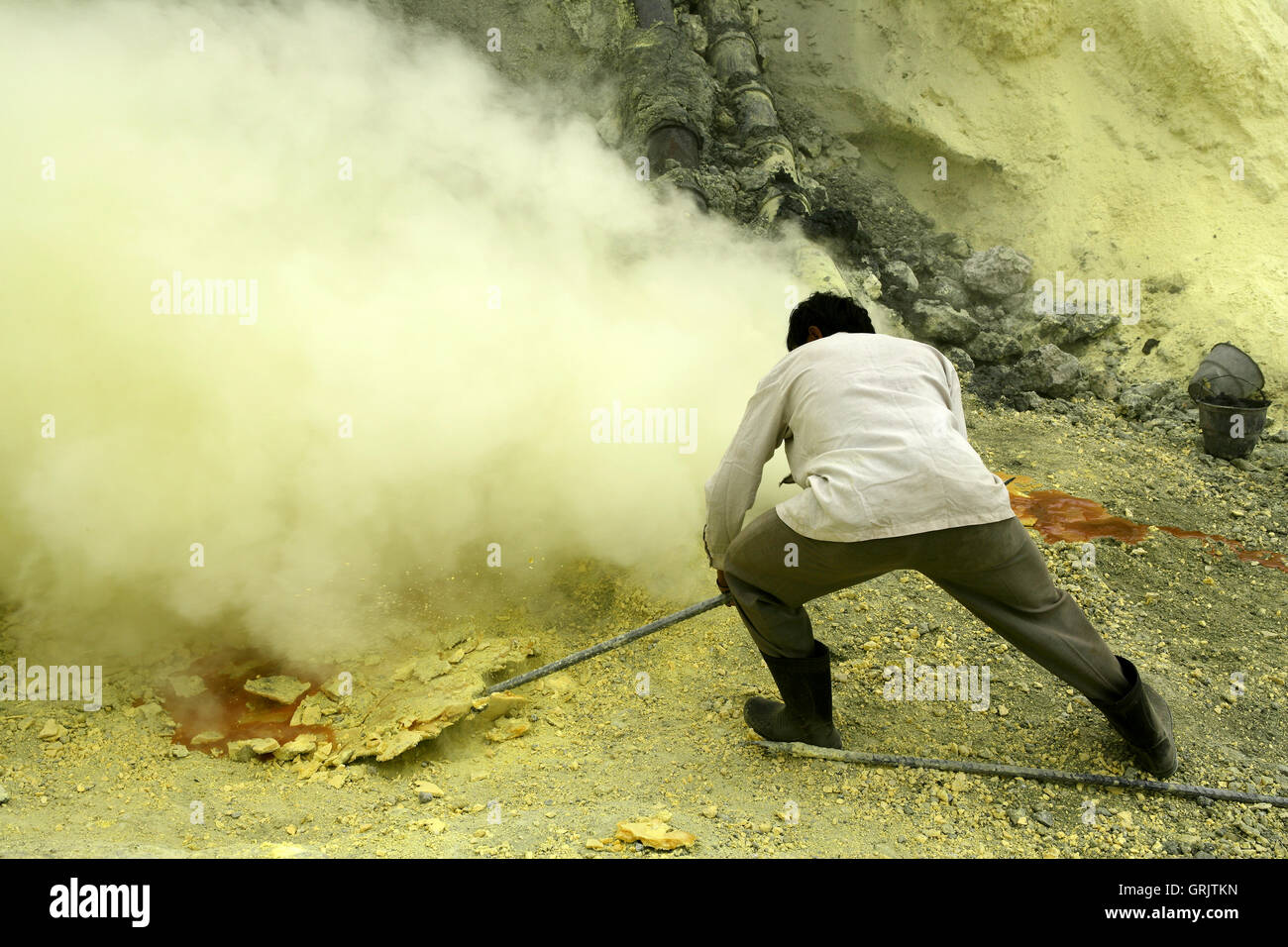 Sulfur miners mining sulfur at Ijen Volcano, Kawah ljen, eastern Java, Java, Indonesia Stock Photo