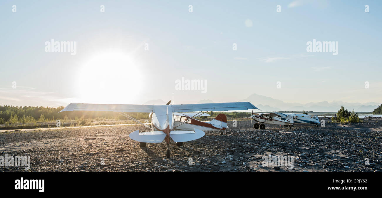 Private planes parked on a gravel bar on the Susitna River in Alaska. Stock Photo