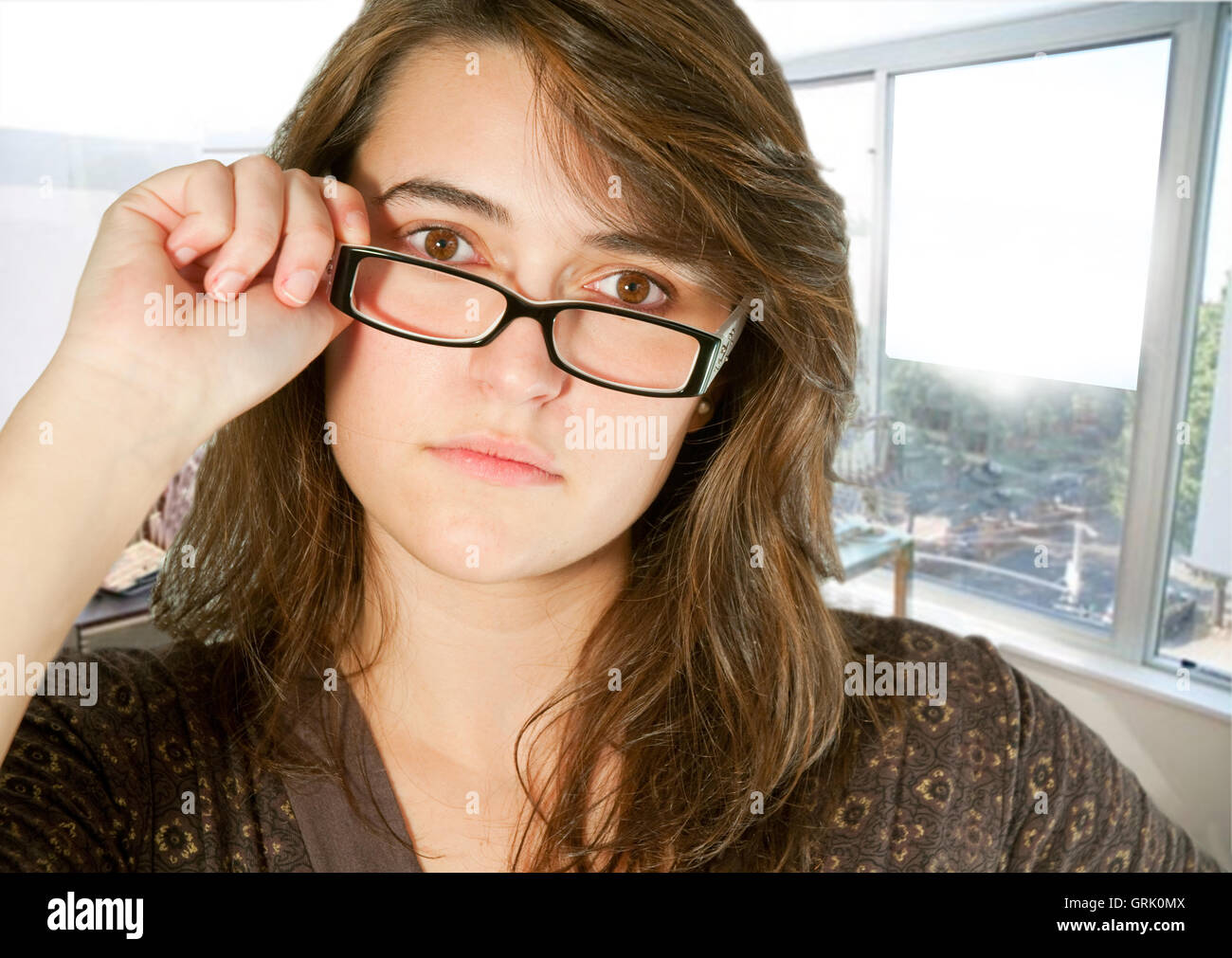 Portrait of young executive woman at the office. Close view. Stock Photo