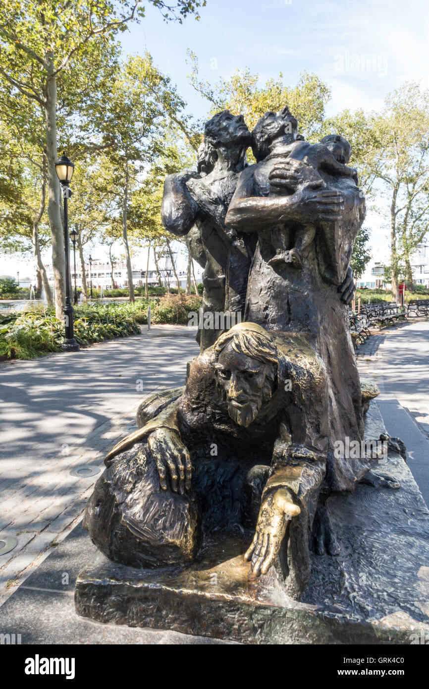 The Immigrants Statue, Battery Park, NYC Stock Photo Alamy