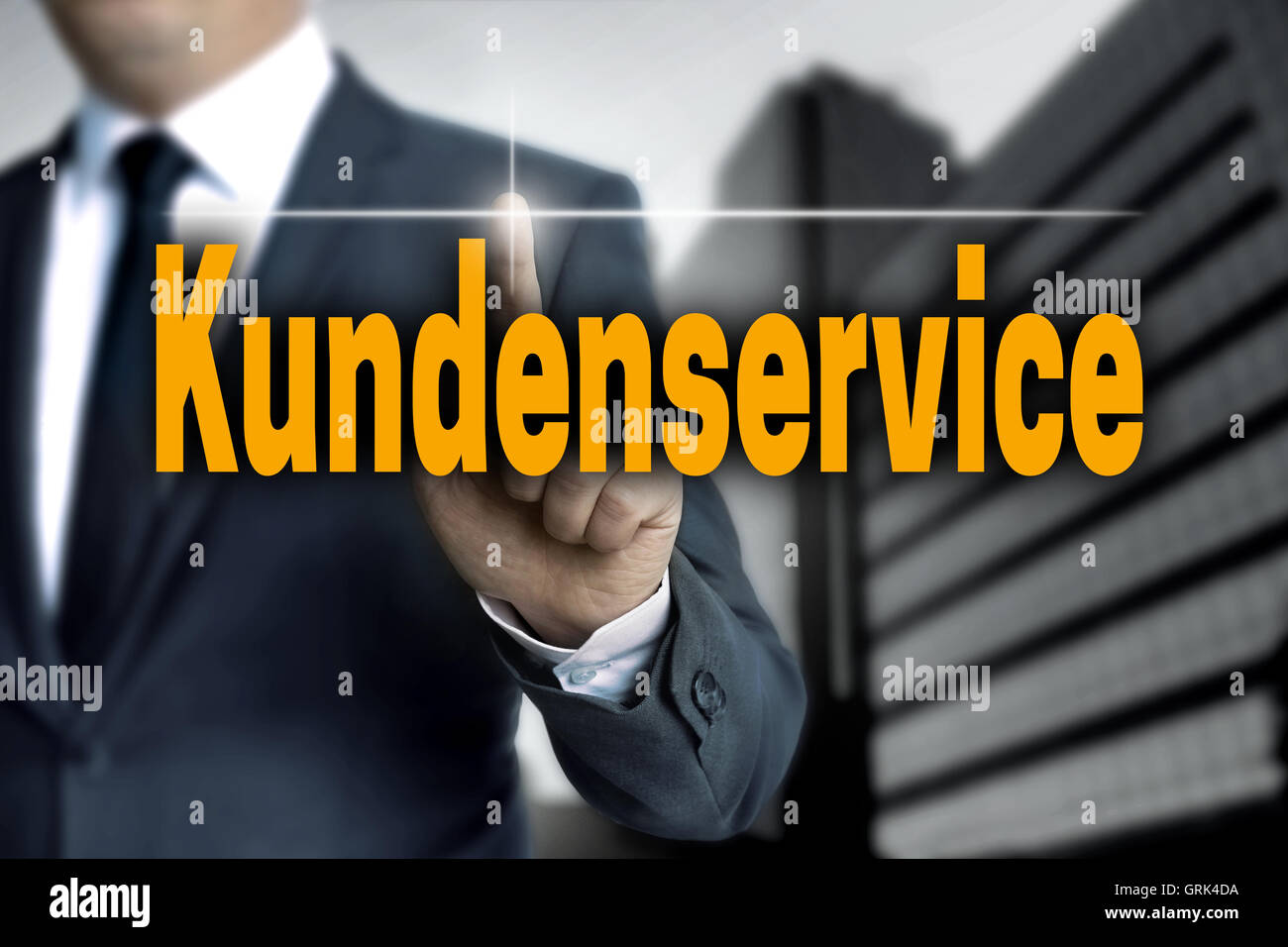 Kundenservice (in german Customer Care) touchscreen is operated by businessman. Stock Photo