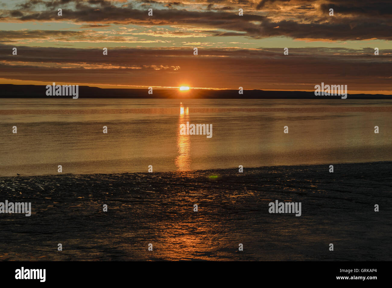 Sunset on the beach Stock Photo - Alamy