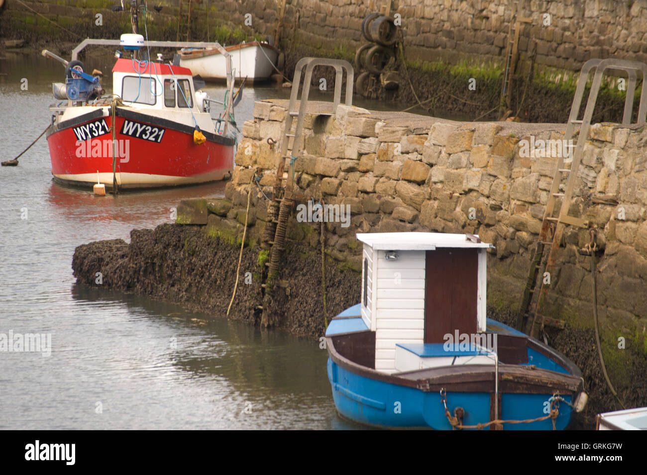 Boats moored at Seaton Sluice harbour Stock Photo Alamy