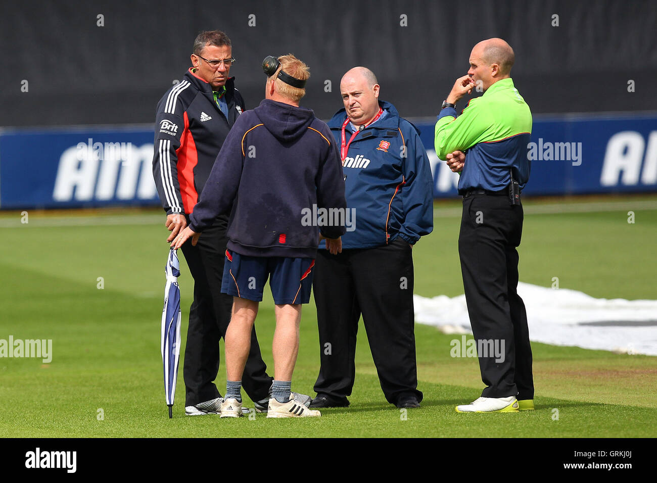 Umpires David Millns (L) and Mike Burns (R) in conversation with ground staff about the prospects of play - Essex Eagles vs Sri Lanka - 50-over Tour Match at the Essex County Ground, Chelmsford - 13/05/14 Stock Photo